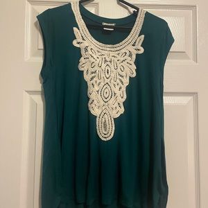 Green top with appliqué